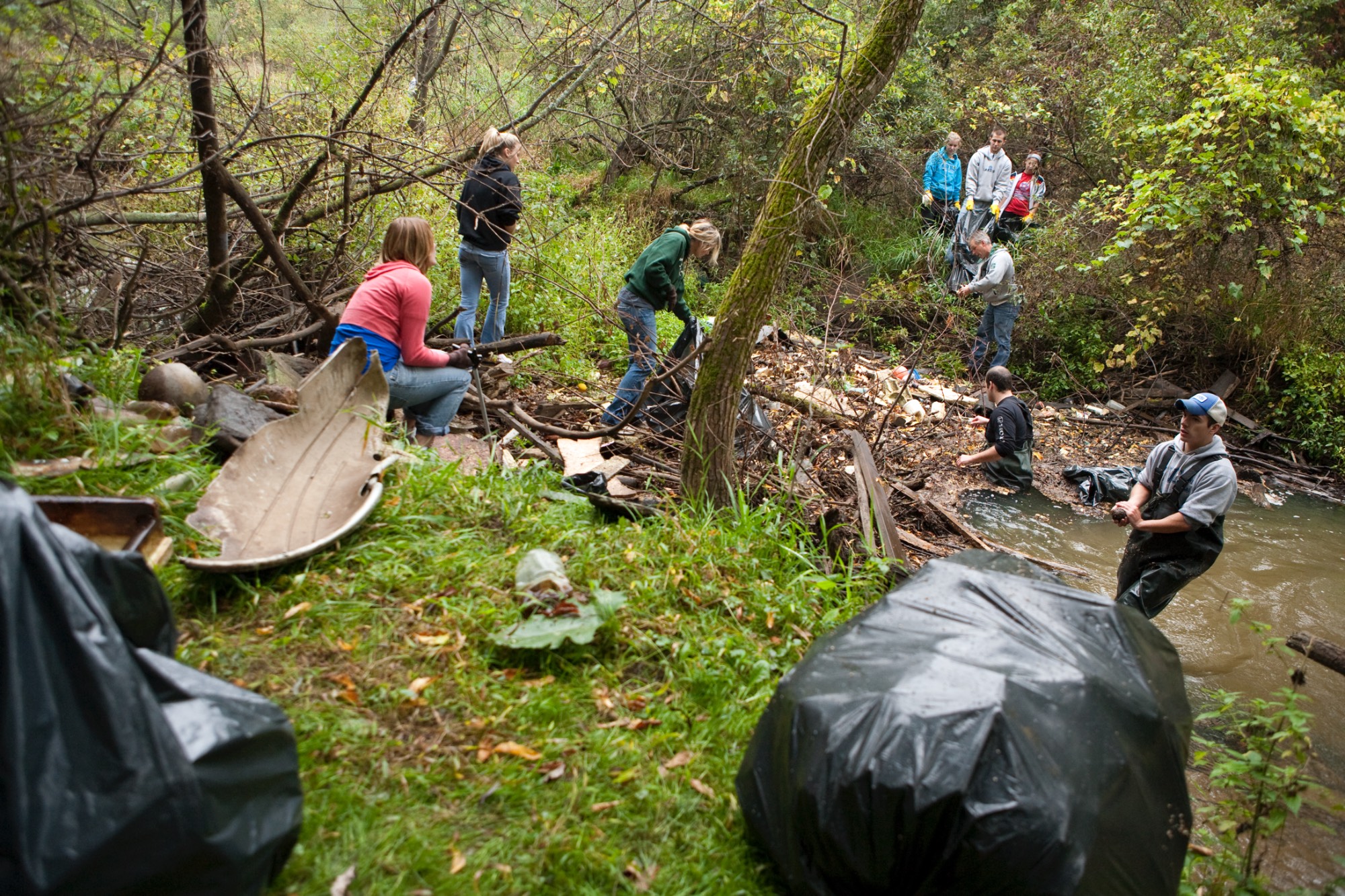 Volunteers clean up the ravines on the Allendale Campus